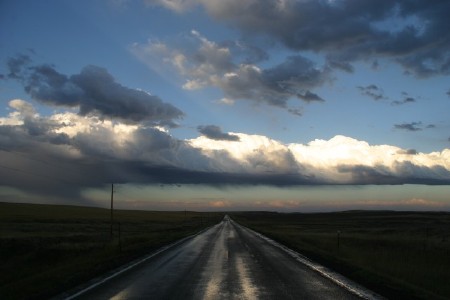 Evening drive down wet Montana highway